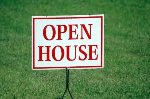 An “open house” sign on a lawn