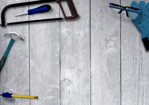 some Home renovation tools on a wooden background