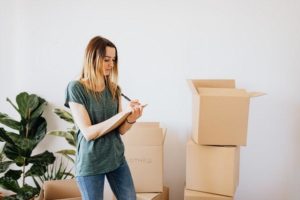 a woman packing for moving house